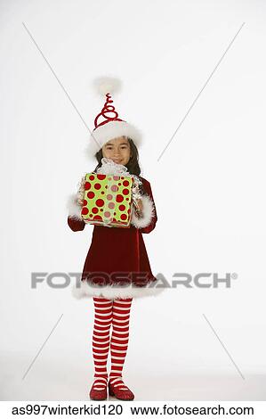 Portrait of a girt holding a gift View Large Photo Image Stock Image - Portrait of a girt holding a gift. Fotosearch