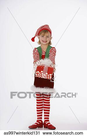 Portrait of a girt holding a gift View Large Photo Image Stock Image - Portrait of a girt holding a gift. Fotosearch