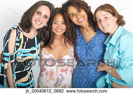Portrait of a group of young women standing together smiling View Large Photo Image Stock Image - Portrait of a group of young women standing together smiling. Fotosearch