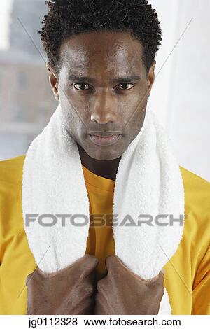 Portrait of a mid adult man holding a towel View Large Photo Image Stock Photo - Portrait of a mid adult man holding a towel. Fotosearch