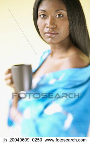 Portrait of a mid adult woman holding a mug View Large Photo Image Stock Image - Portrait of a mid adult woman holding a mug. Fotosearch