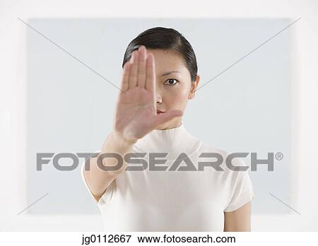 Portrait of a mid adult woman showing her palm View Large Photo Image Stock Photo - Portrait of a mid adult woman showing her palm. Fotosearch