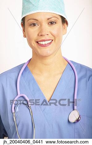 Portrait of a young female doctor in full scrubs View Large Photo Image Stock Image - Portrait of a young female doctor in full scrubs. Fotosearch