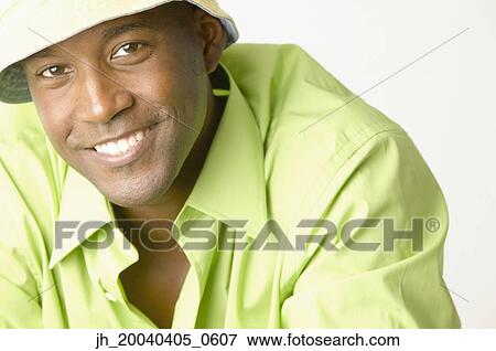 Portrait of a young man smiling View Large Photo Image Stock Photo - Portrait of a young man smiling. Fotosearch