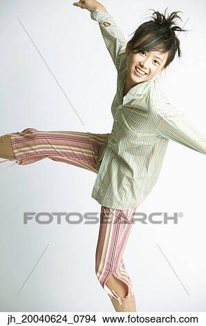 Picture - Portrait of a young woman smiling. Fotosearch