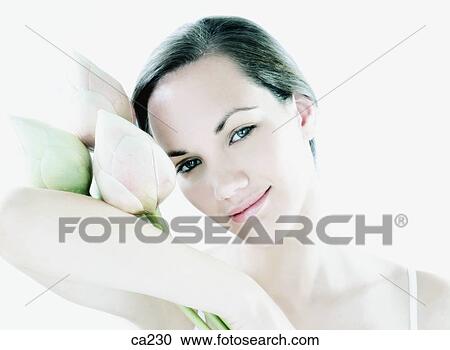 Stock Image - Portrait of a young woman smiling. Fotosearch
