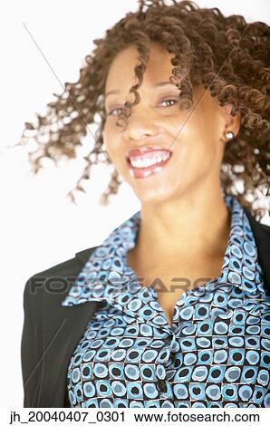Portrait of a young woman smiling View Large Photo Image Stock Image - Portrait of a young woman smiling. Fotosearch