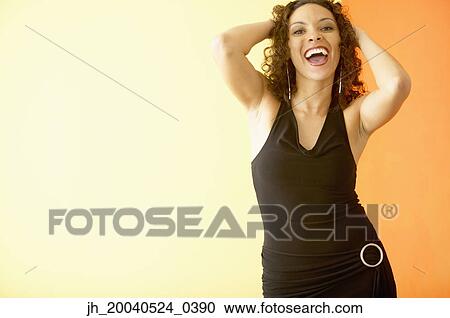 Portrait of a young woman smiling View Large Photo Image Stock Image - Portrait of a young woman smiling. Fotosearch