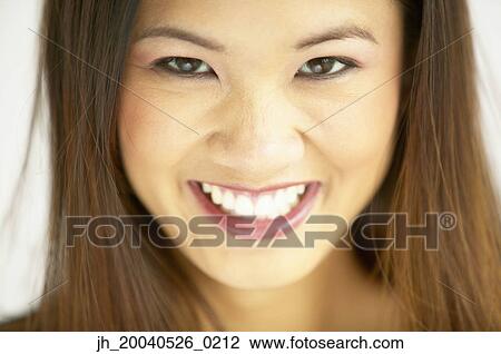 Portrait of a young woman smiling View Large Photo Image Stock Image - Portrait of a young woman smiling. Fotosearch