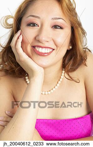 Portrait of a young woman smiling View Large Photo Image Stock Image - Portrait of a young woman smiling. Fotosearch
