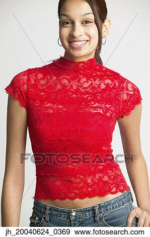 Portrait of a young woman smiling View Large Photo Image Stock Photo - Portrait of a young woman smiling. Fotosearch