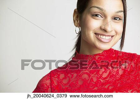 Portrait of a young woman smiling View Large Photo Image Stock Photo - Portrait of a young woman smiling. Fotosearch