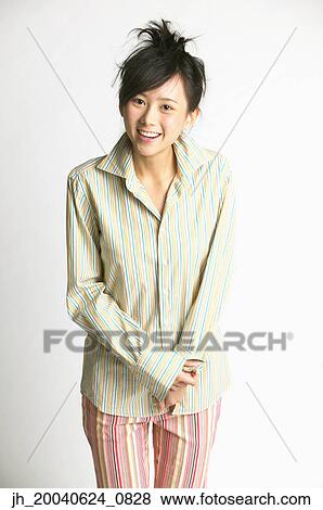 Stock Photo - Portrait of a young woman smiling. Fotosearch