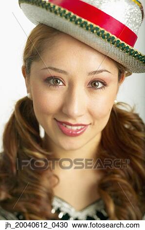 Portrait of a young woman wearing a hat View Large Photo Image Stock Image - Portrait of a young woman wearing a hat. Fotosearch