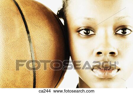 Portrait of a young woman with a basketball View Large Photo Image Picture - Portrait of a young woman with a basketball. Fotosearch