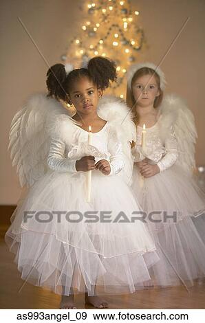Portrait of two girls in fairy costumes View Large Photo Image Stock Photo - Portrait of two girls in fairy costumes. Fotosearch