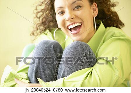 Portrait of young woman smiling View Large Photo Image Stock Image - Portrait of young woman smiling. Fotosearch