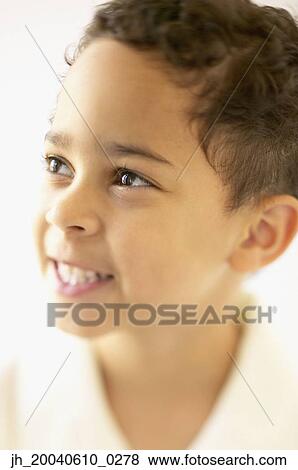 Young boy smiling View Large Photo Image Stock Photo - Young boy smiling. Fotosearch