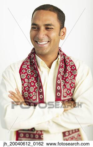 Young man standing wearing a traditional outfit View Large Photo Image Stock Image - Young man standing wearing a traditional outfit. Fotosearch
