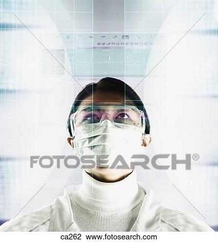 Young man wearing a surgical mask View Large Photo Image Stock Image - Young man wearing a surgical mask. Fotosearch