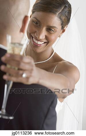 Young newly wedded couple dancing View Large Photo Image Stock Photograph - Young newly wedded couple dancing. Fotosearch