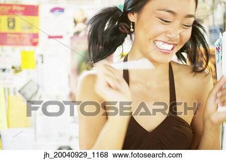 Young woman laughing View Large Photo Image Stock Photo - Young woman laughing. Fotosearch