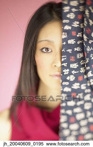 Young woman looking at camera View Large Photo Image Stock Photography - Young woman looking at camera. Fotosearch