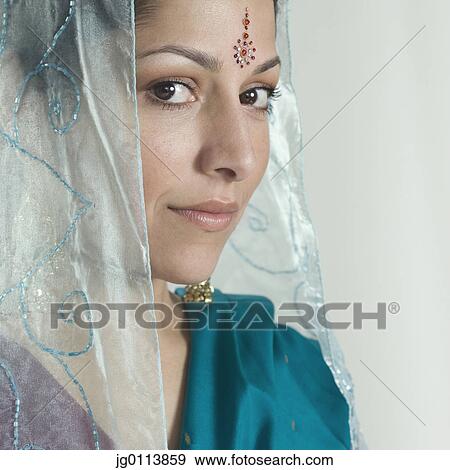 Close-up of a mid adult woman smiling View Large Photo Image Stock Photo - Close-up of a mid adult woman smiling. Fotosearch