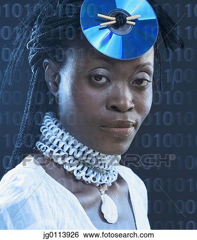 Close-up of a mid adult woman wearing a CD on her head View Large Photo Image Stock Photograph - Close-up of a mid adult woman wearing a CD on her head. Fotosearch