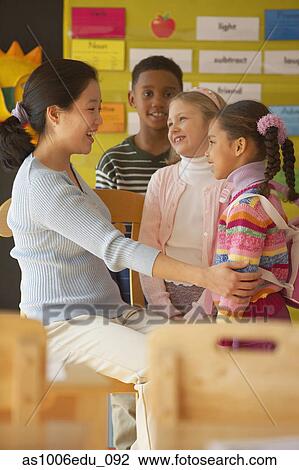 talking teacher students female classroom fotosearch