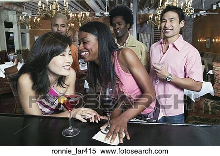 Group of people enjoying in a nightclub View Large Photo Image Stock Photography - Group of people enjoying in a nightclub. Fotosearch