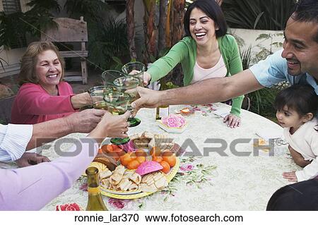 Group of people toasting glasses of wine View Large Photo Image Stock Image - Group of people toasting glasses of wine. Fotosearch