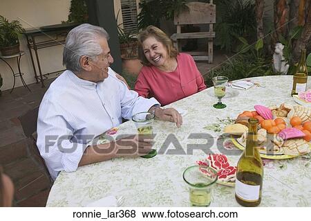 High angle view of a mature couple seated at a table View Large Photo Image Stock Photo - High angle view of a mature couple seated at a table. Fotosearch