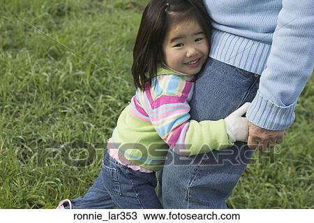 Portrait of a girl holding hands of her grandfather View Large Photo Image Stock Image - Portrait of a girl holding hands of her grandfather. Fotosearch