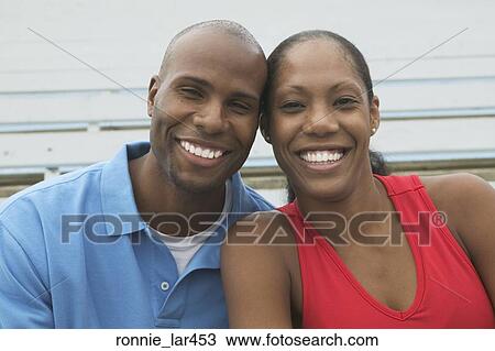 Portrait of a mid adult couple smiling View Large Photo Image Stock Image - Portrait of a mid adult couple smiling. Fotosearch