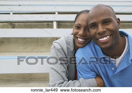 Portrait of a mid adult couple smiling View Large Photo Image Stock Photo - Portrait of a mid adult couple smiling. Fotosearch