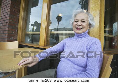 Portrait of a senior woman smiling View Large Photo Image Stock Image - Portrait of a senior woman smiling. Fotosearch