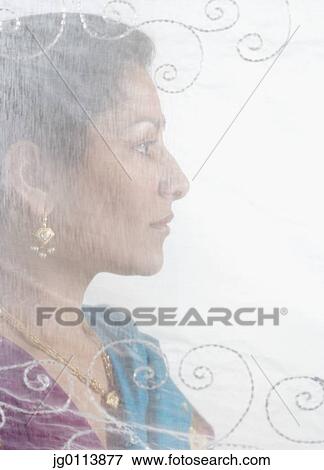 Side profile of a mid adult woman View Large Photo Image Stock Photo - Side profile of a mid adult woman. Fotosearch