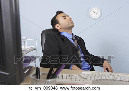 Businessman asleep at his desk View Large Photo Image Stock Photo - Businessman asleep at his desk. Fotosearch