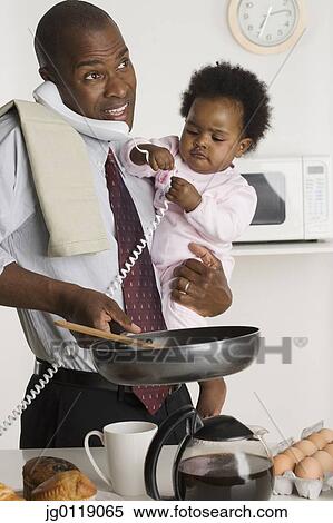 Businessman multitasking at home View Large Photo Image Stock Photography - Businessman multitasking at home. Fotosearch