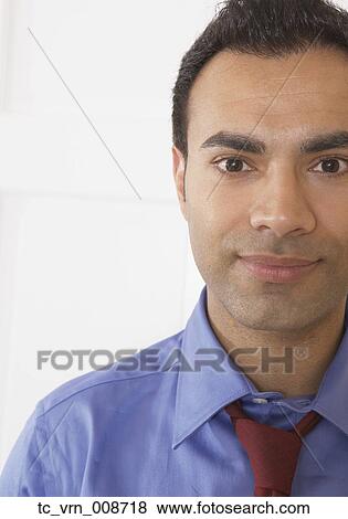Stock Photo - Businessman smiling for the camera. Fotosearch