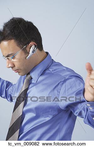 Businessman wearing sunglasses and a headset View Large Photo Image Stock Image - Businessman wearing sunglasses and a headset. Fotosearch