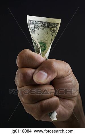 Close up of hand holding dollar bill View Large Photo Image Picture - Close up of hand holding dollar bill. Fotosearch