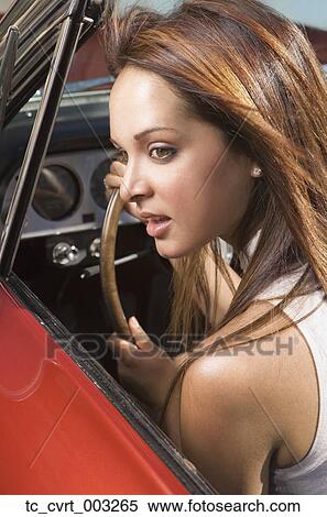 Close up of woman driving convertible View Large Photo Image Stock Photography - Close up of woman driving convertible. Fotosearch