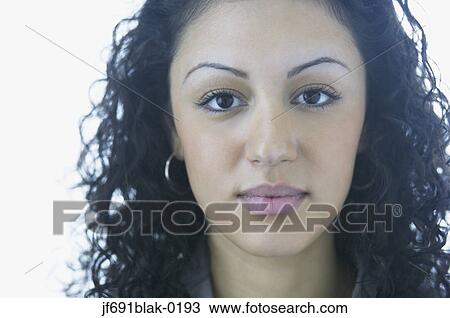 Stock Image - Close up of young woman's face. Fotosearch