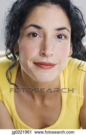Stock Image - Close up of young woman's face. Fotosearch