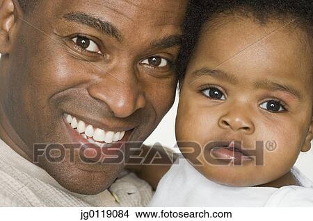 Picture - Father and daughter posing for the camera. Fotosearch