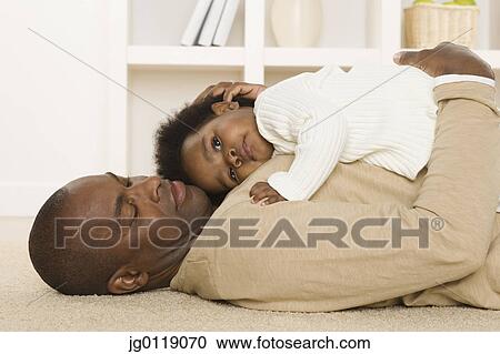 Father spending time with his baby daughter View Large Photo Image Stock Image - Father spending time with his baby daughter. Fotosearch