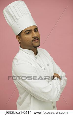 Male chef posing for the camera with arms crossed View Large Photo Image Picture - Male chef posing for the camera with arms crossed. Fotosearch