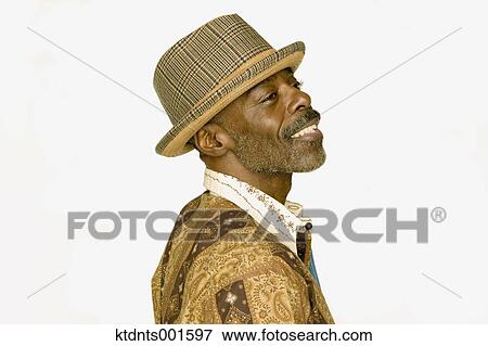 Stock Photo - Middle aged man in bright clothing smiling for the camera. Fotosearch